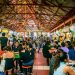 Locals enjoying food from a Hawker Center in Singapore